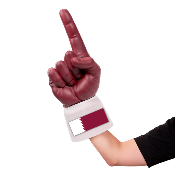 Fan wearing Qatar RadHand Foam Finger for international soccer match day